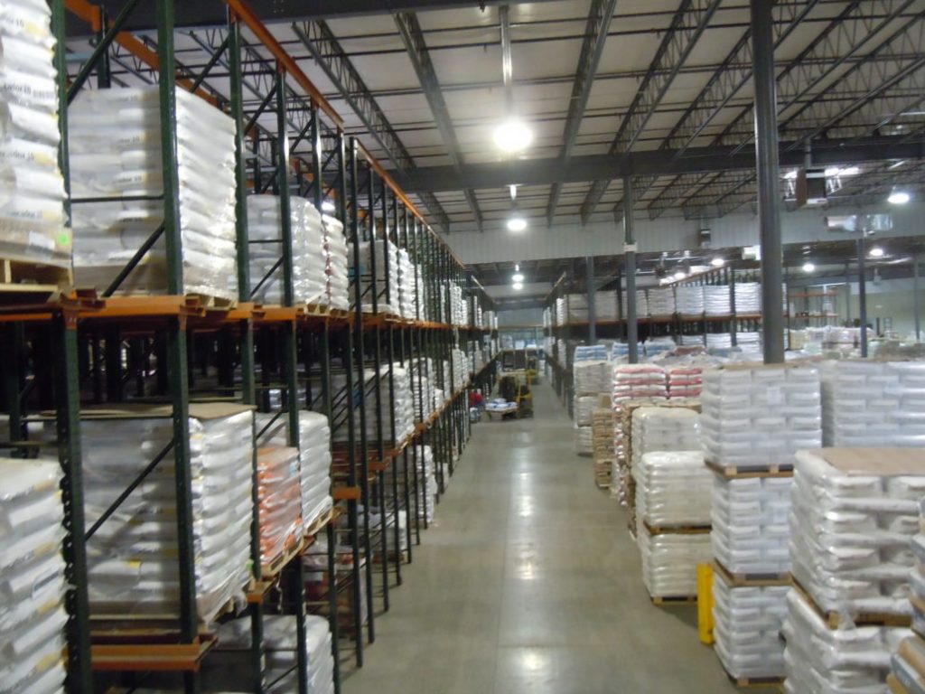 Warehouse Interiors with Shelves, pallets and boxes